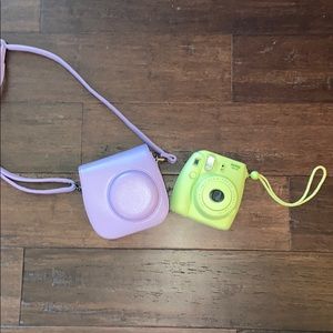 instax mini camera with a purple case